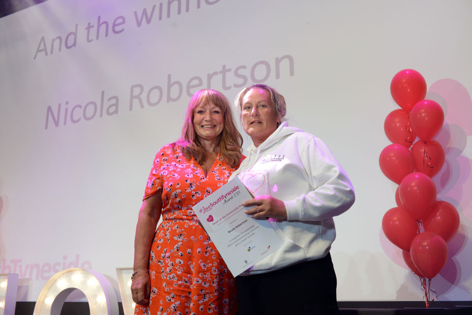 Winner, Nicola Robertson, collecting their award